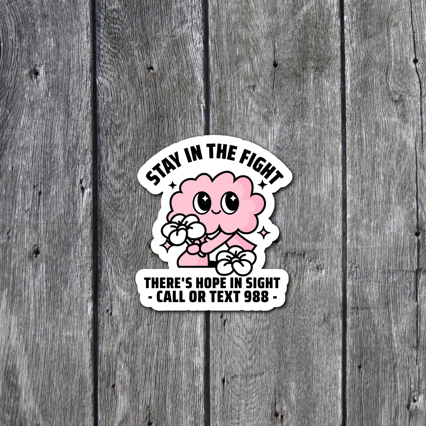 There's Hope In Sight Call or Text 988 - Suicide Prevention and Crisis Helpline Sticker with pink brain character holding a flower. Close up front view.