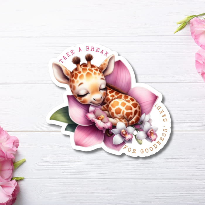 front view of pastel watercolor sticker with motivational message on a white wooden background