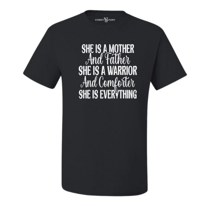 She Is Everything Inspirational Black T-shirt for mothers. Short Sleeve with white bold and cursive font on a white background front view.