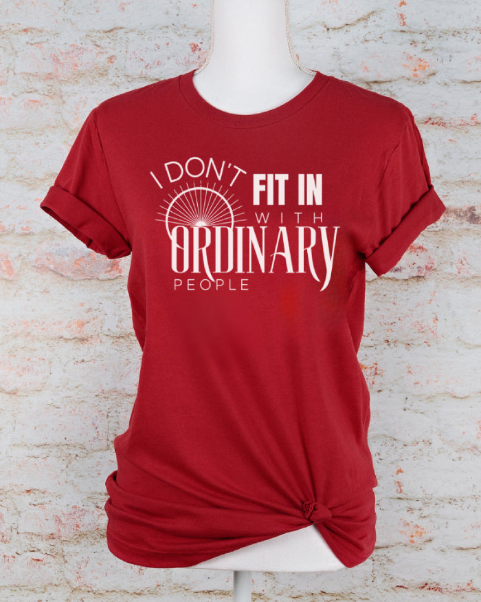 Red and white mental health inspired tshirt featuring a quote of "I Don't Fit In, in white lettering