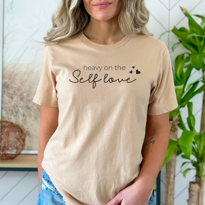 Self-love focused t-shirt with heart design, ideal for mental health advocates, with a short sleeve and relaxed fit for easy everyday wear.