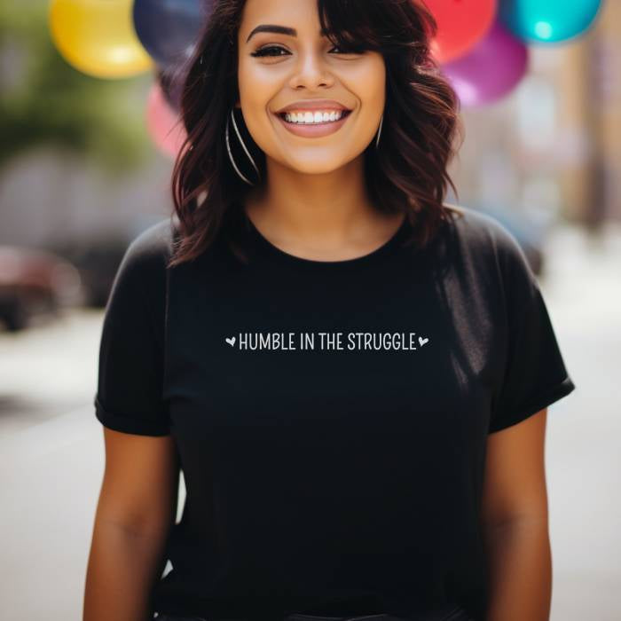 Women's graphic tee showcasing an inspirational design and powerful struggle quote. Great as a thoughtful gift for those seeking a humbling boost of inspiration.