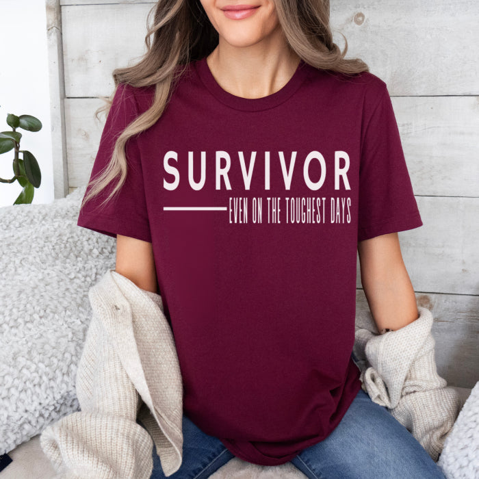 Women's maroon crew neck cotton t shirt, featuring a mental health quote for survivors. Ideal for those suffering from trauma and overcoming mental health illness.