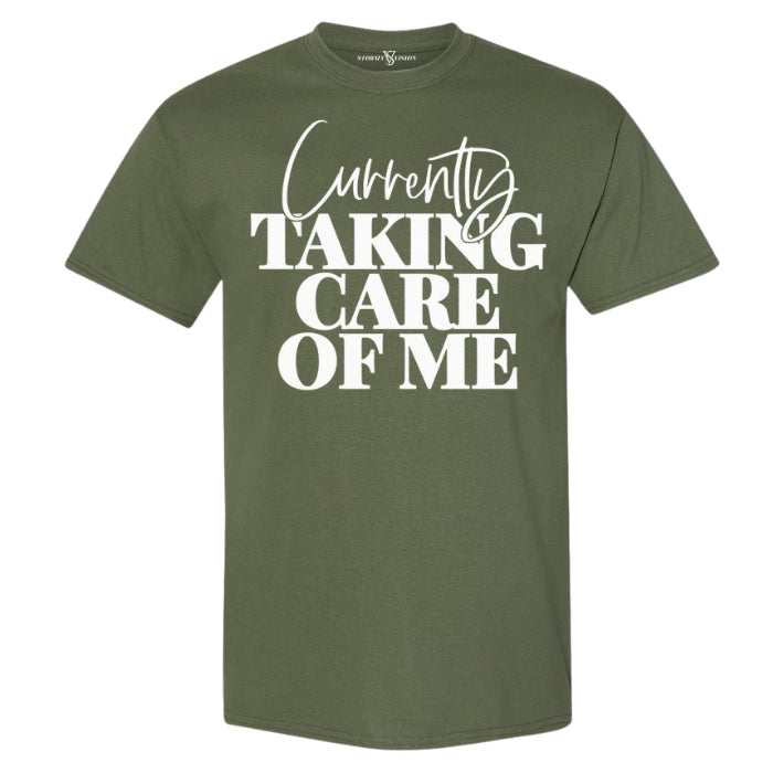 Women's fall green and white cute inspirational graphic tee, with self care quote in white bold font.