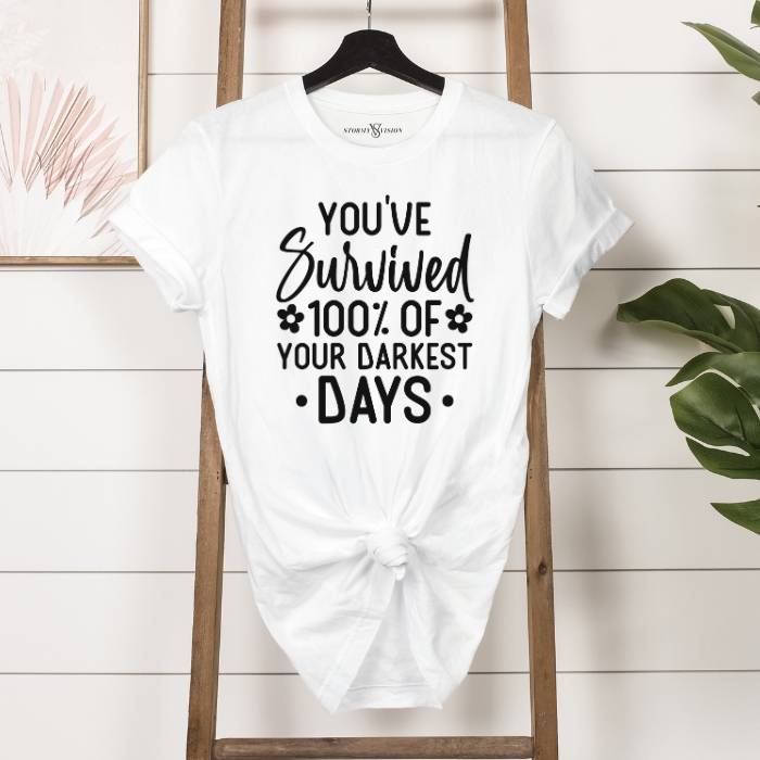 Women's graphic white tee with mental health saying and retro design, pairs well with a light jacket for cooler days.