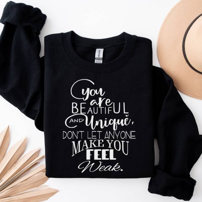 Warm and cozy "You Are Beautiful" crewneck, perfect for chilly fall days, with a empowering graphic design. pairs well with your favorite jeans.