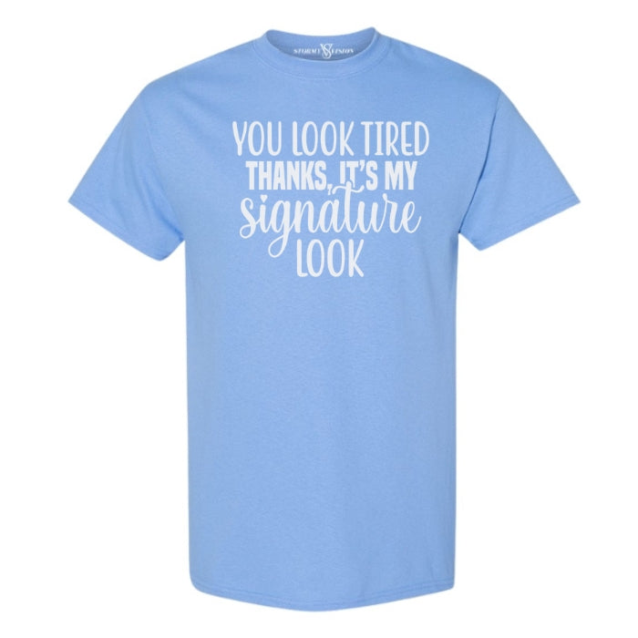 You Look Tired Sarcastic Mental Health T-shirt. Carolina Blue short sleeve shirt frontal view on white background.