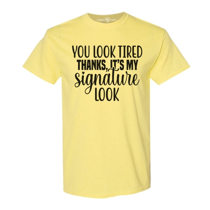 You Look Tired Sarcastic Mental Health T-shirt. Cornsilk Yellow short sleeve shirt frontal view on white background.