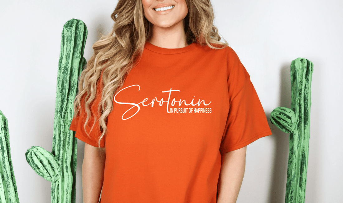 Woman wearing an orange Serotonin T-Shirt image for a blog post called The Psychology of Inspirational T-Shirts