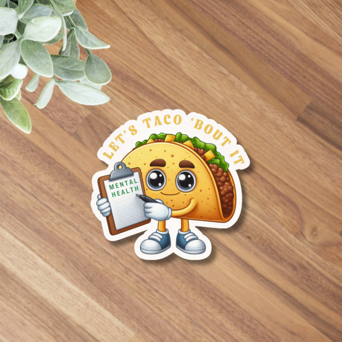 Inspirational mental health taco sticker close up on wooden background