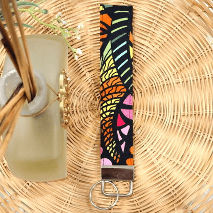 Colorful Zen tangle Wristlet Keychain on a wicker basket - stormy vision