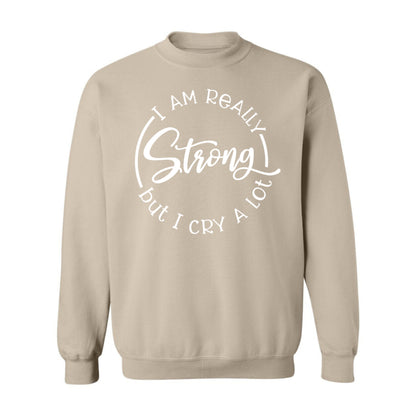 Inspirational "Strong, but Cry A Lot" loose fit, long sleeve sweater. great for women in high-stress jobs, pairs well with casual wear.