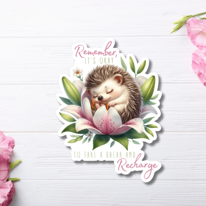 close up view of watercolor sticker on a white wooden background with pink flowers.