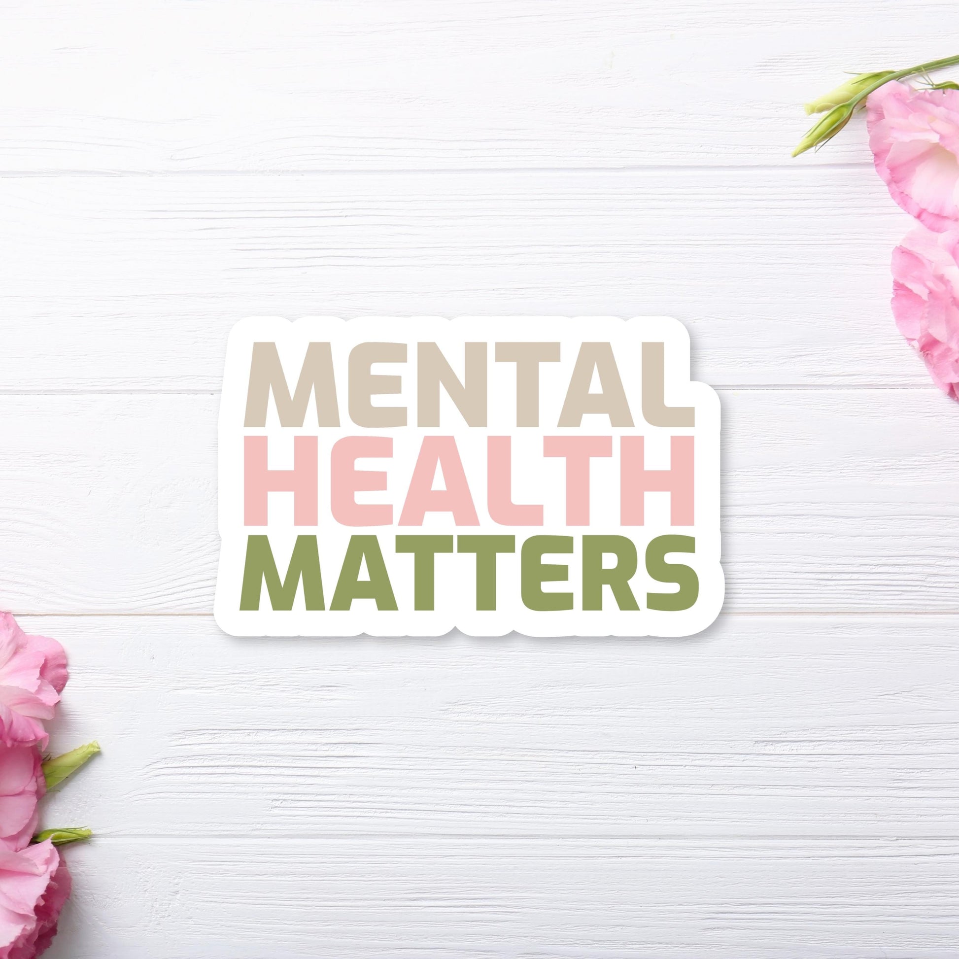 Mental Health Matters Inspirational Sticker - with Pastel Brown, Pink and Green Colors on white wooden background. Close Up