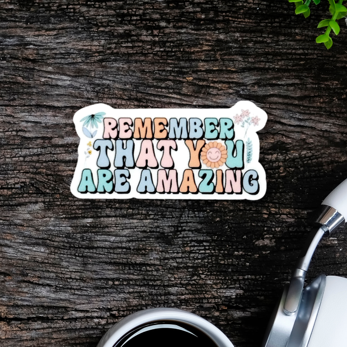 Floral sticker with inspiring affirmation message on a wooden background