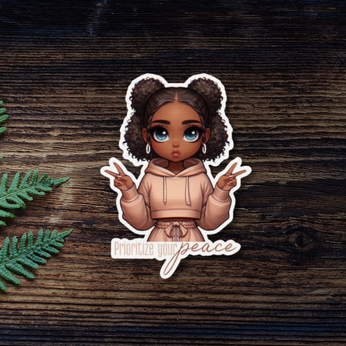 black girl peace sticker close up on wooden background