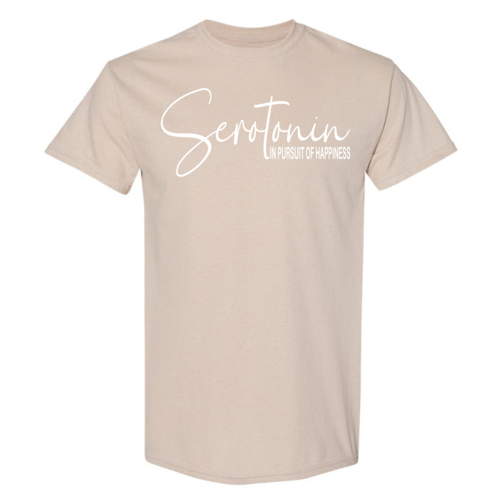 Casual everyday cotton t-shirt in sand color, featuring a Pursuit of Happiness quote on front.