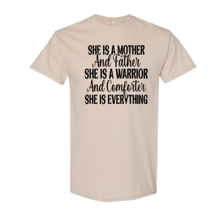She Is Everything Inspirational Sand T-shirt for mothers. Short Sleeve with black bold and cursive font on a white background front view.