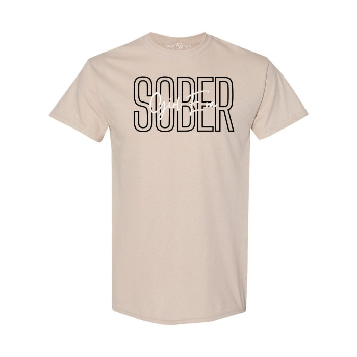 Sober Girl Era Sand Sobriety Tee For Women. Short Sleeve, Round Neck Tee with black and white font on a white background. Front View.