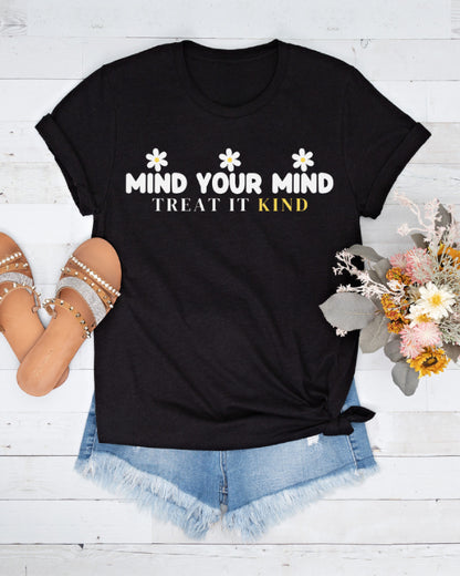 Classic black cotton tee, with daisy flower graphics and Kind Mind wording, great for everyday inspiration.