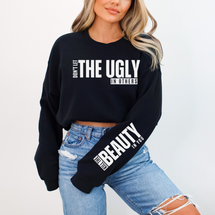 Encourage self-love with this black and white premium quality "Don't Let The Ugly In Others" graphic sweatshirt.