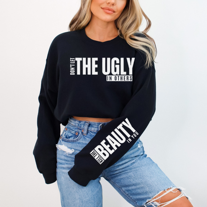 Encourage self-love with this black and white premium quality "Don't Let The Ugly In Others" graphic sweatshirt.