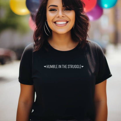 Women's graphic tee showcasing an inspirational design and powerful struggle quote. Great as a thoughtful gift for those seeking a humbling boost of inspiration. 