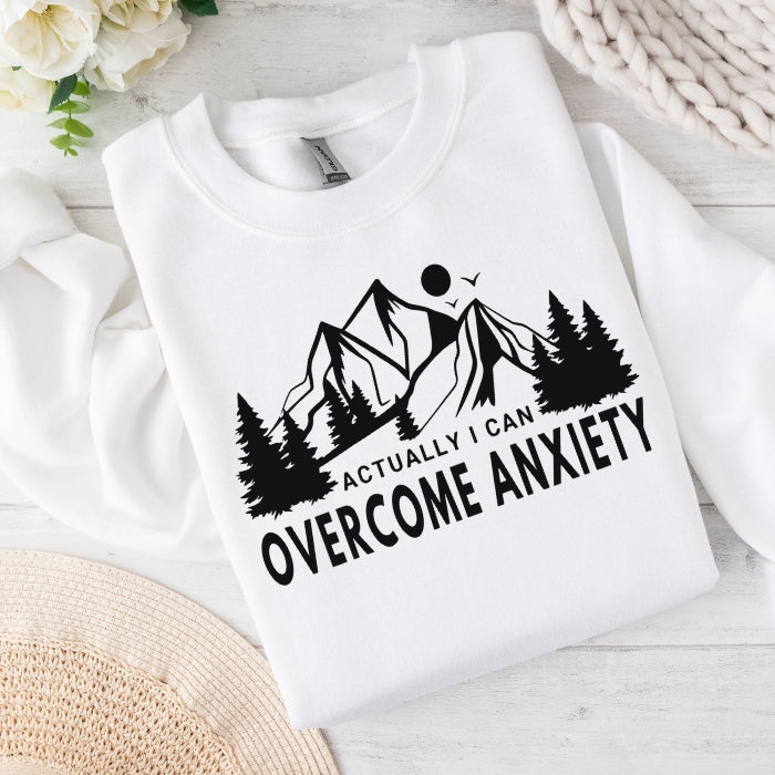 Women's Overcome Anxiety white pullover sweatshirt, with a mountain design,  ideal for those on a journey to overcome anxiety.