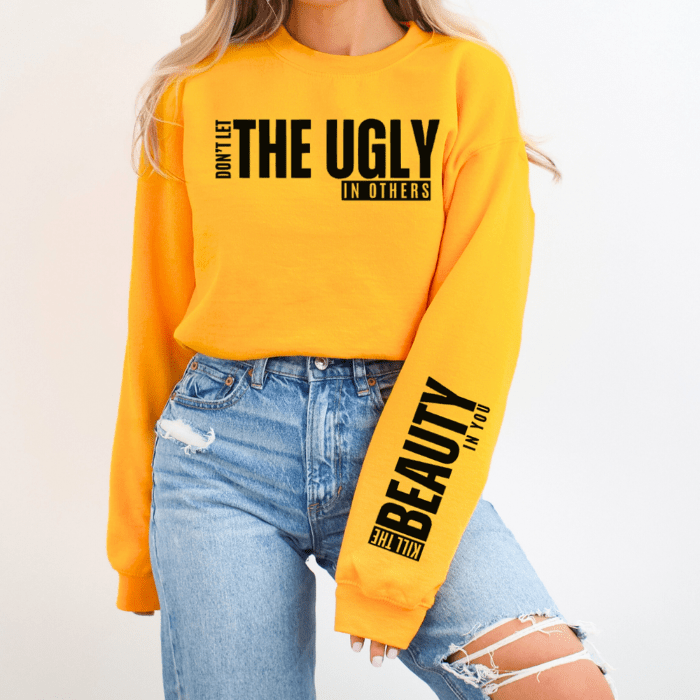 Premium quality gold and black plus-size sweatshirt with inspiring sleeve design, ideal for women of all sizes.